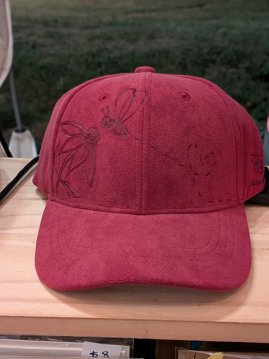 Cap with flower and bee